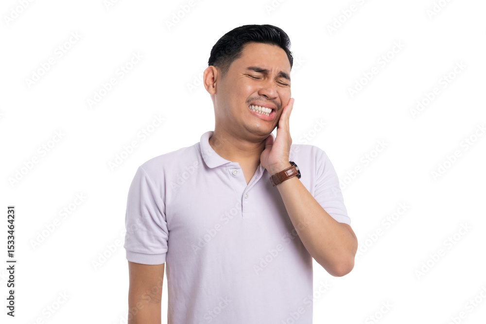 Fototapeta premium Young man suffering from toothache touching his cheek in pain while wearing casual shirt isolated on transparent background