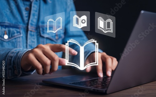 Wallpaper Mural Hands interacting with digital book icons on a laptop. Torontodigital.ca