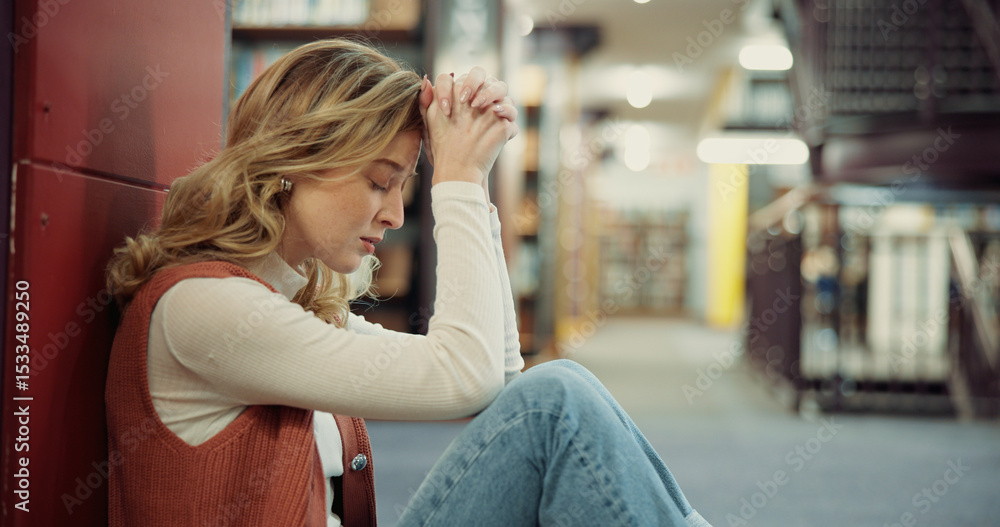 Fototapeta premium University, girl and stress on library floor for academic burnout, student loans or study fatigue. Education, anxiety and person with depression on campus for workload pressure or overwhelmed by exam