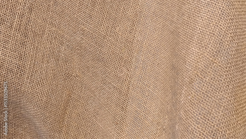 Close-up of fabric woven from burlap. Texture of natural burlap fabric for background. Hessian sack material texture, burlap cloth background