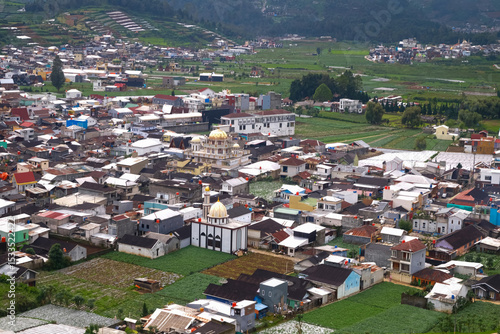 Aerial View of Colorful Town and Green Fields