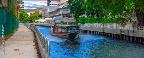 Wallpaper Mural Ferry boat going through a Canal Khlong in Thai running from Soi 15 Sukhumvit Rd NANA to Soi 21 Sukhumvit Rd Asoke in BKK Bangkok Thailand Torontodigital.ca