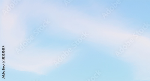Soft white clouds float in a light blue sky creating a peaceful scene.