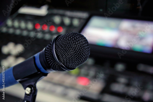 Fotografía Close-up microphone with audio mixer background for instrument feedback sound check or live podcast and producer broadcasting studio