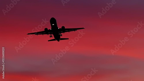 Wallpaper Mural Airplane Silhouette Ascending Against a Vibrant Sunset Sky Torontodigital.ca