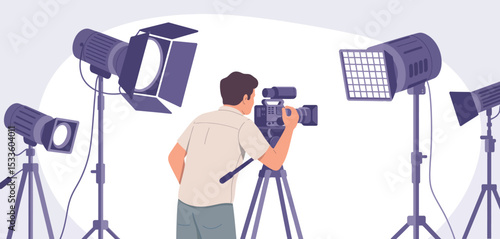 Cameraman filming with professional lighting equipment