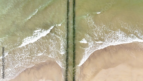 Fototapeta Naklejka Na Ścianę i Meble -  Breakwater on the North Sea photographed with a drone