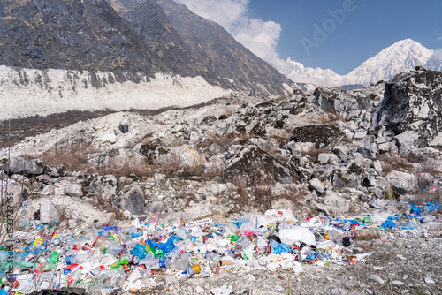 Photography Garbage and plastic bottles scattered below glacier on Manaslu Circuit, Bimthang