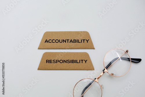 Фотография Paper with the words accountability and responsibility