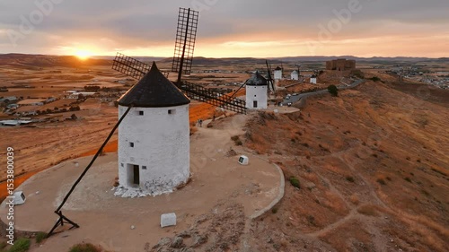Aerial view of the windmills of Consuegra at sunset, Castilla-La Mancha, Spain.
