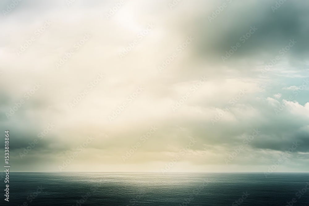 Fototapeta premium Serene seascape depicting a dramatic sky filled with fluffy clouds over tranquil ocean waters
