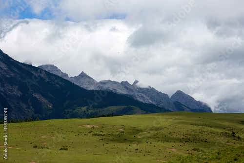 Wallpaper Mural Lijiang Jade Dragon Snow Mountain mist-shrouded mountain range and vertical vegetation scenery Torontodigital.ca