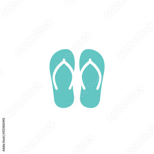Colorful flip-flops on a sandy beach with ocean waves and a clear sky in the background