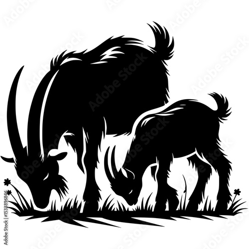 Silhouette of adult goat and kid grazing