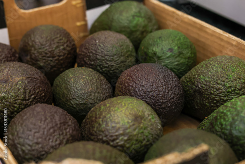 Avocados in a cardboard box