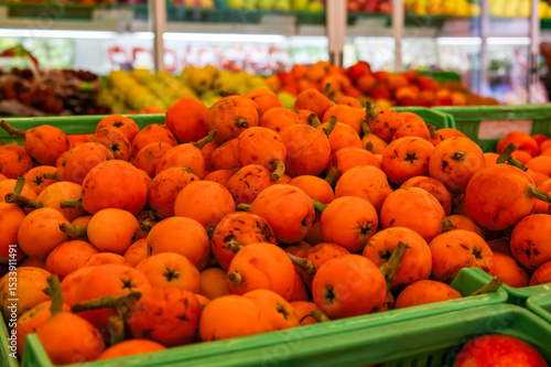 Fresh seasonal loquats on display in a Spanish fruit shop