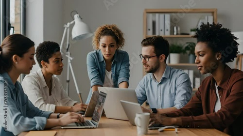 Diverse team collaborating in modern office setting