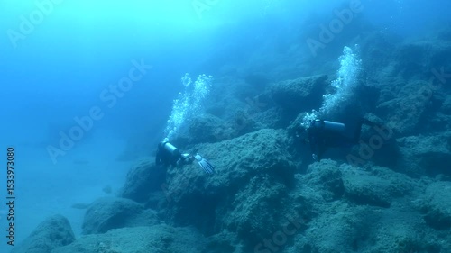 Wallpaper Mural underwater scenery of big rocks topography scuba divers exploring Torontodigital.ca