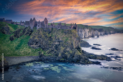 Dunluce Castle at Sunset – Dramatic Sky and Reflections on the Sea, Northern Ireland