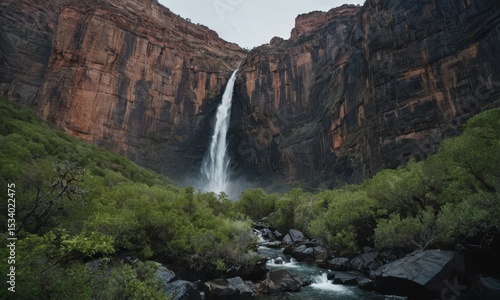 Majestic Waterfall Cascading Down Sheer Cliff in Zion National Park