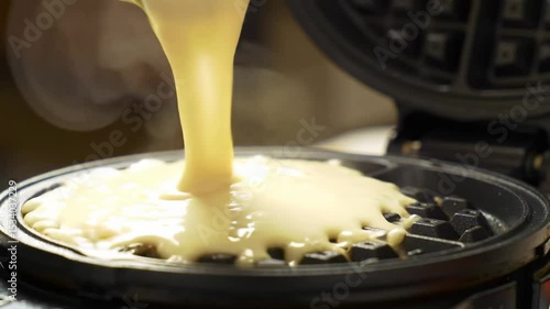 Waffle Batter Pouring onto Hot Iron for Breakfast