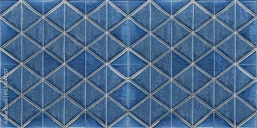 Geometric blue tile pattern with a shimmering effect.