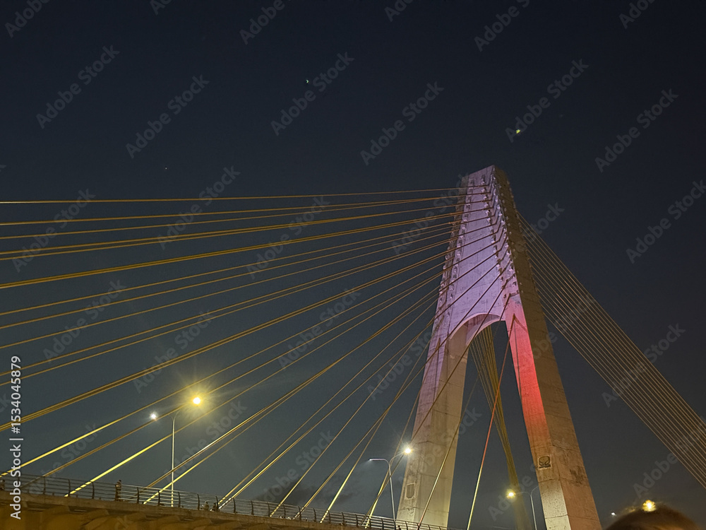 Obraz premium Siak I Bridge at night, or known as Leighton Bridge, is the name of bridge located in Pekanbaru City, Riau Province, Indonesia