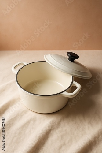 Wallpaper Mural A stylish, off-white cooking pot with its lid slightly ajar, sitting on a neutral-colored surface. Its clean lines and subtle color palette evoke a sense of modern elegance Torontodigital.ca