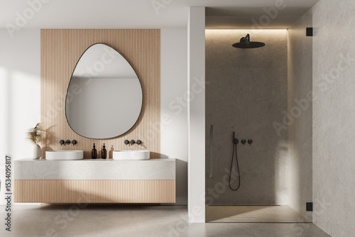 Konstfotografi Modern minimalist bathroom interior with wood panel wall, asymmetrical mirror, dual sinks, and walk-in stone shower under warm ambient lighting