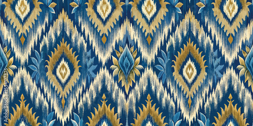 Vibrant blue and gold floral ikat pattern on fabric.