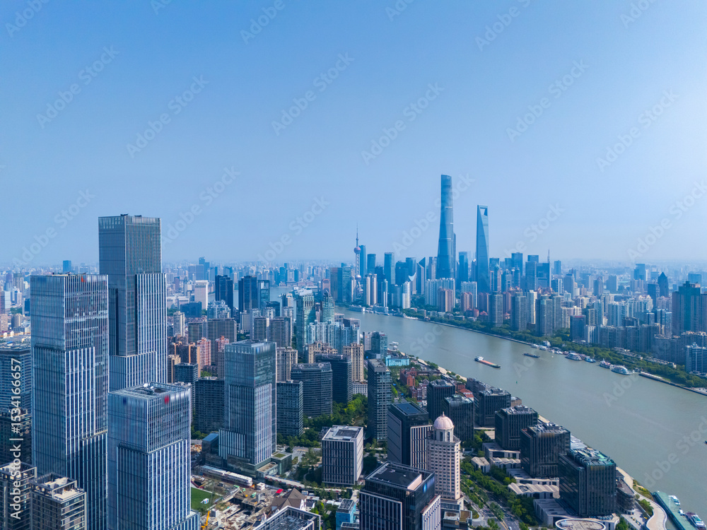 Fototapeta premium Aerial view of Shanghai skyscraper in downtown with blue sky background.