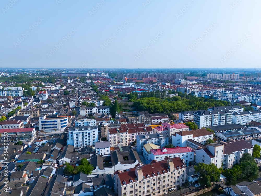 Naklejka premium Aerial view of Shanghai Xinchang Ancient Town on sunny day, One of the most famous ancient towns in Shanghai.