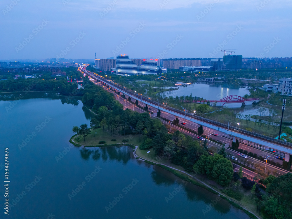 Fototapeta premium aerial view of urban scenery in the suburbs, with beautiful lake garden, Shanghai.