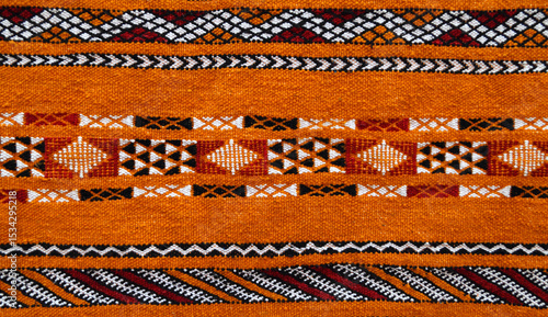 Morocco, Marrakesh. Historic medina - detail ot typical Berber carpet on display - natural dyes and typical ancient Berber symbols
