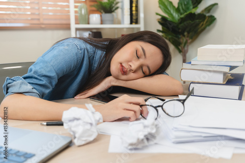 Papier peint Person fall asleep on the desk have overwork night.