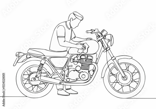 A person cleaning a classic motorcycle.