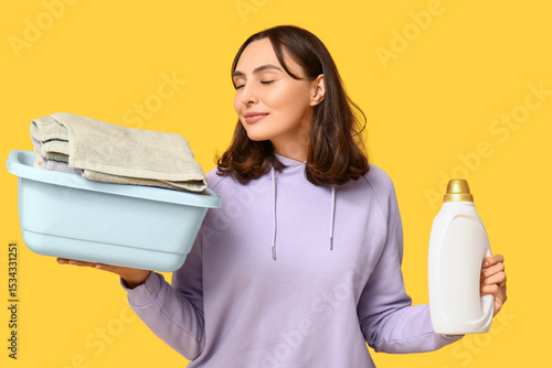 Young woman with laundry ba...