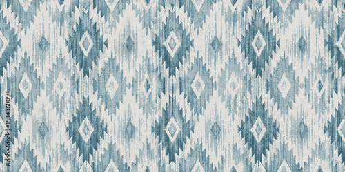 Abstract geometric pattern in cool blue tones with a textured diamond design.