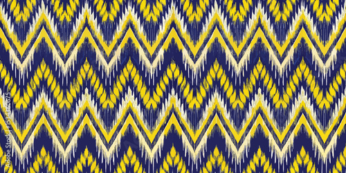 Vibrant zigzag pattern in blue and yellow tones on a textured background.