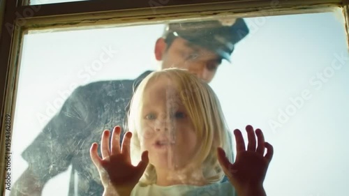 Child's Wonder A Touching Moment Through Glass