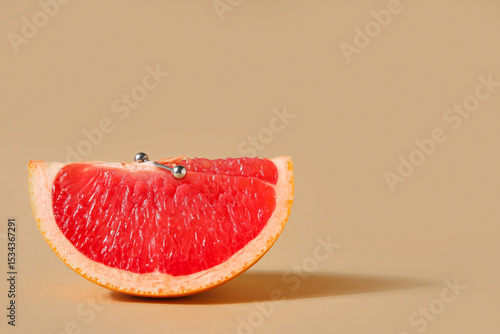 Piece of grapefruit with pi...
