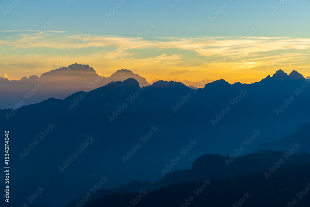 Fototapeta premium Golden hour illuminating the Dolomites mountain range in San Vito di Cadore, Italy