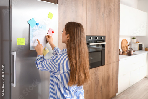 Young woman with to-do list...