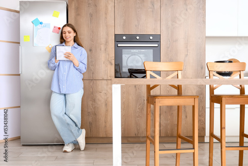 Young woman making to-do li...