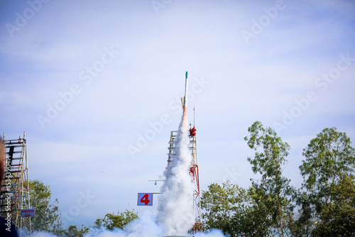 Fototapeta Naklejka Na Ścianę i Meble -  Yasothon, Thailand -18 May 2025 : Yasothon Rocket Festival Lighting rockets is a ritual asking for rain to the gods to get water for agriculture. according to local beliefs joyful atmosphere,to local