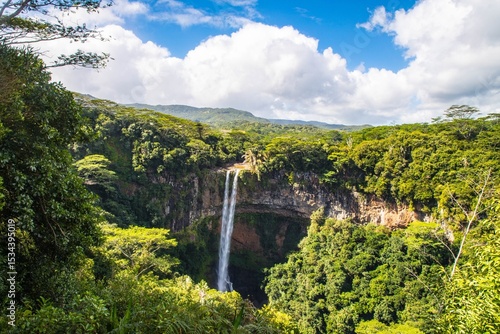 Beautiful scenery of Chamarel Waterfall in Mauritius under a cloudy sky