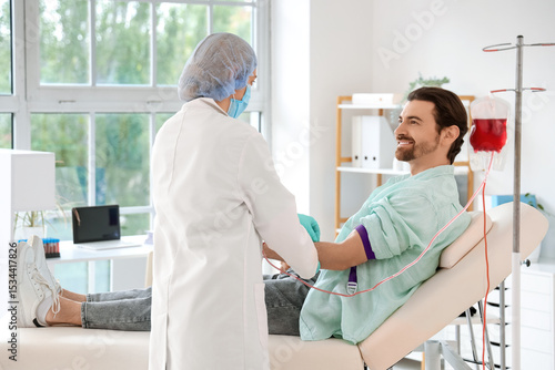 Female doctor taking blood ...