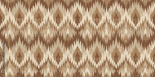 Stylish brown and beige ikat pattern texture.