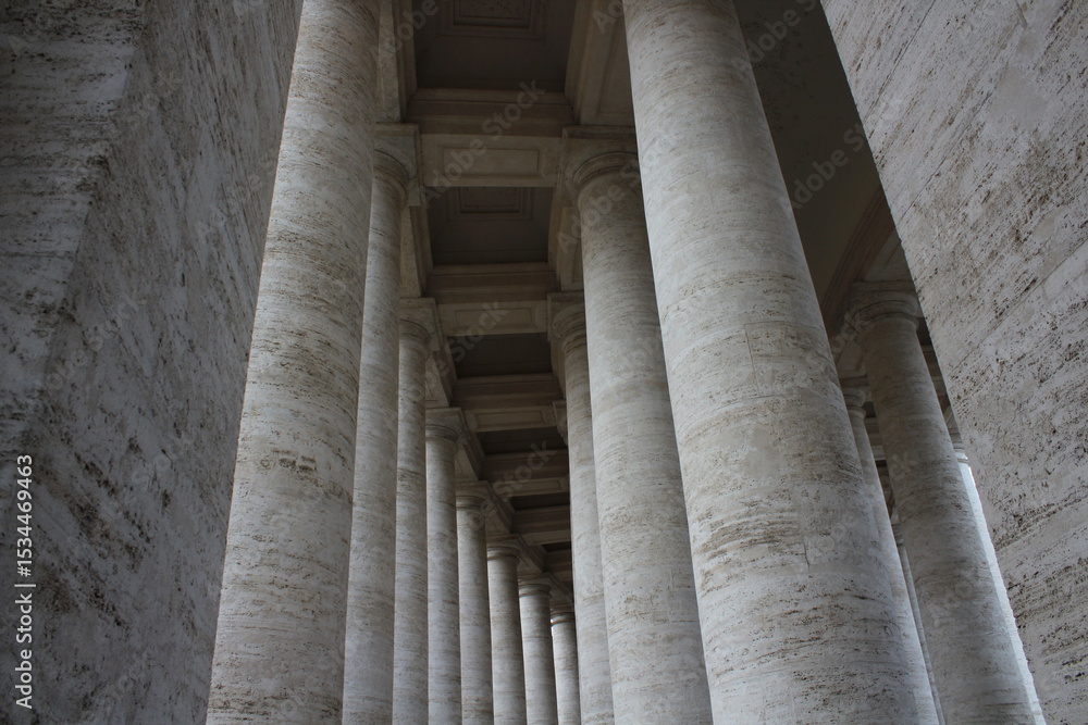 Columned hallway in Saint Peter-s Square. Beautiful ancient architecture with huge marble pillars and blue sky background. Ancient architectural background wallpaper. Vatican pillars
Columned hallway in Saint Peter-s Square. Beautiful ancient architecture with huge marble pillars and blue sky background. Ancient architectural background wallpaper. Vatican pillars