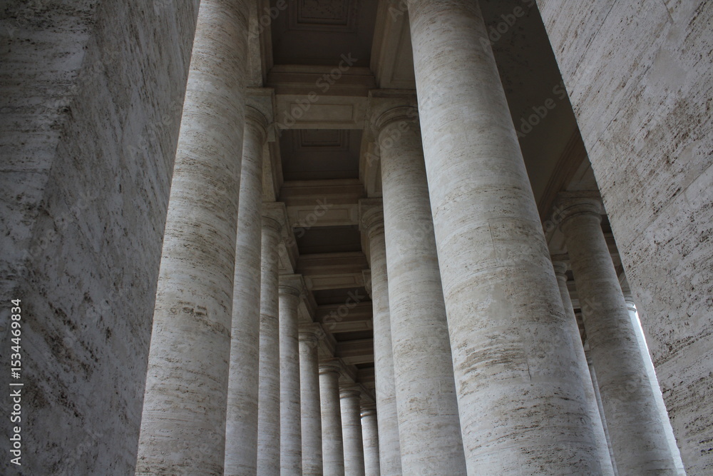 Columned hallway in Saint Peter-s Square. Beautiful ancient architecture with huge marble pillars and blue sky background. Ancient architectural background wallpaper. Vatican pillars
Columned hallway in Saint Peter-s Square. Beautiful ancient architecture with huge marble pillars and blue sky background. Ancient architectural background wallpaper. Vatican pillars